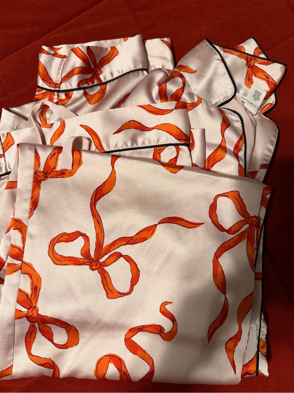 Victoria's Secret Pink Satin Pajama Set with Orange Ribbon Print
